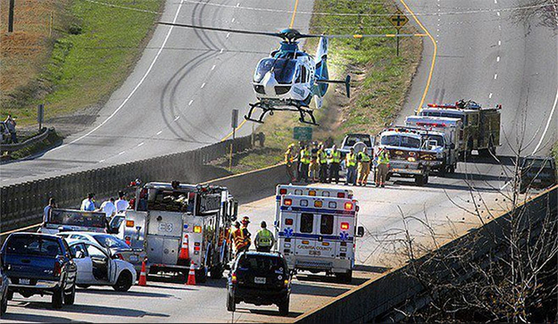 Medical helicopter at accident scene with EMS & Flight Safety Net Team