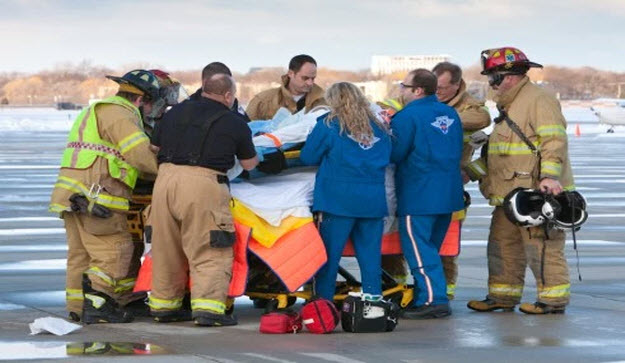 Firefighters and Paramedics treating patient